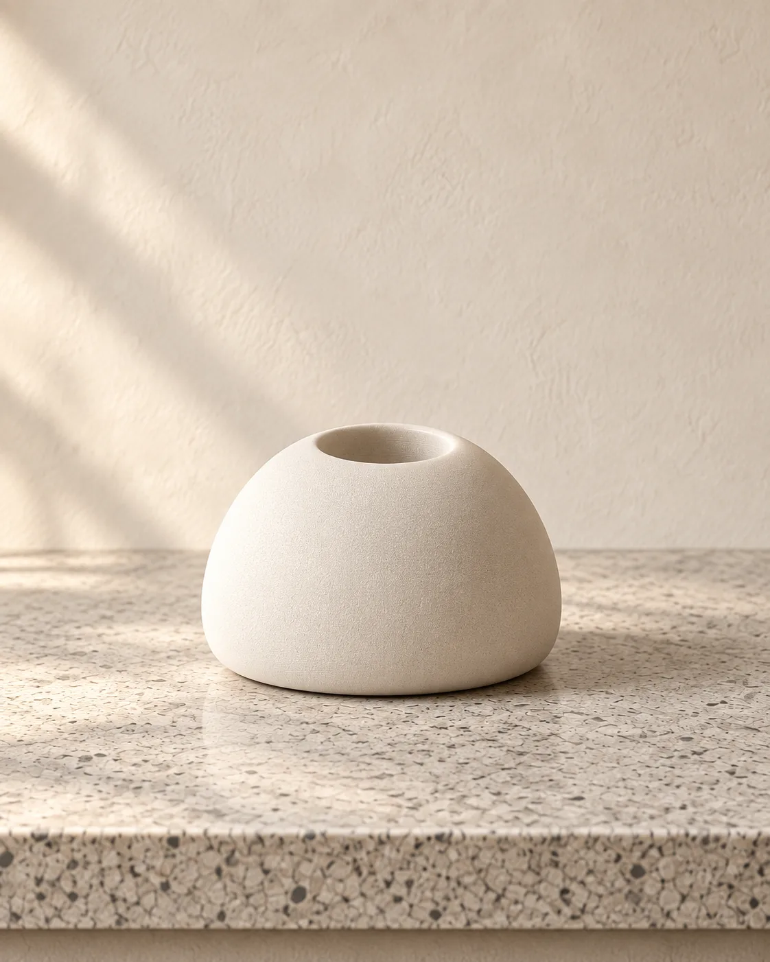 Pebble fruit-fly trap on a stone counter
